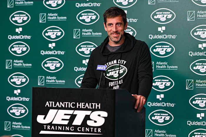 Jets' QB Aaron Rodgers at the podium during OTAs